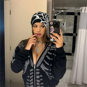 Hip hop black knit beanie featuring a white jacquard spider web pattern and rhinestone detail