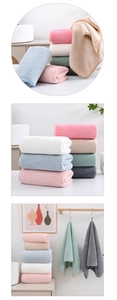 Close-up of waffle weave coral fleece towels in pastel colors for high water absorption
