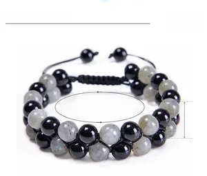 Macro shot of double-layer woven bracelet with 8mm labradorite and black onyx beads