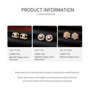 Detailed macro shot of 14k gold plated pearl earrings with zircon inlay designs