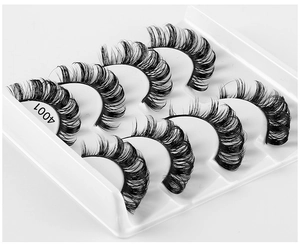 Detailed macro view of five pairs of 4001 black curly false eyelashes in a white tray