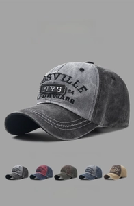Detail of vintage washed baseball caps in five colors with professional embroidery