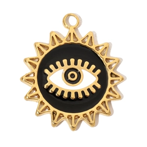 Macro view of gold-plated sun and evil eye pendant with black enamel inlay