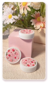 Close-up of strawberry scented nail polish remover wipes in pink boxes with floral decor
