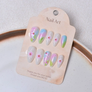 Floral press-on nails with pink 3D flower relief and gradient pastel almond shape nails