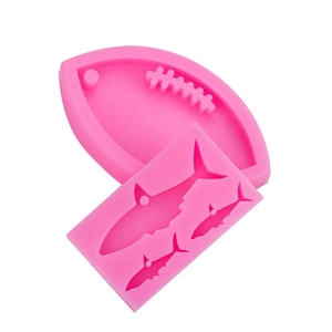 Rosa Silikonformen für Rugbybälle und Haifisch-Anhänger zum Selbermachen