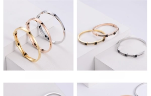 Detail of square black gemstone and pavé diamonds on a sleek metal clasp bangle
