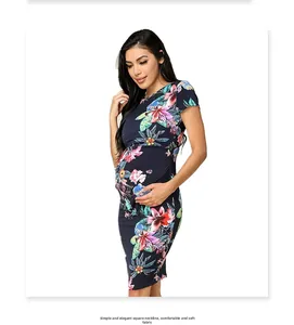 Detail of floral print nursing dress featuring a classic crew neck and soft jersey fabric