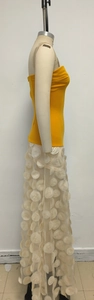 Detail of yellow tube top and cream tulle skirt featuring 3D floral applique on mannequin