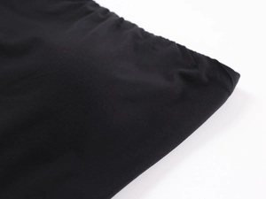 Close-up of seamless stitching and elastic fabric texture of black tube top