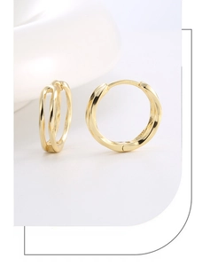 Detailed close-up of 14K gold plated hollow double-loop earrings with huggie closure