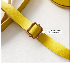 Detail of bright yellow lychee leather strap with gold adjustable metal buckle
