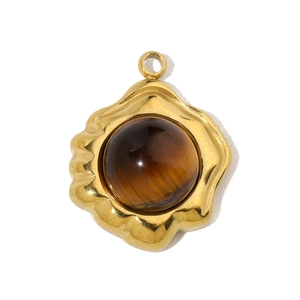 Detailed view of natural tiger eye stone pendant in a wavy gold stainless steel setting