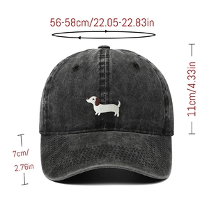 Detail view of grey denim baseball cap featuring dachshund embroidery and size annotations