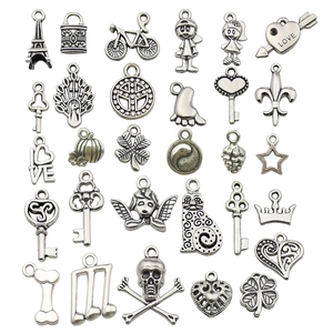 Set of 30 assorted silver alloy charms including hearts and stars for DIY jewelry making