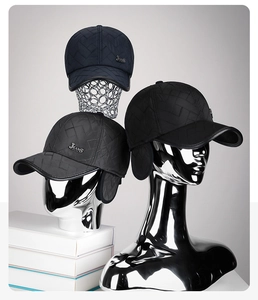 Detailed quilted texture of winter thermal baseball caps with metal JEANS logo accents