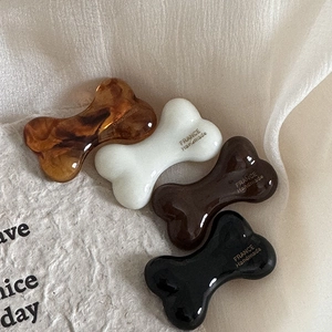 Cute bone-shaped hair clips in cream, coffee, and tortoise shell resin finishes