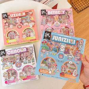 Close-up of four colorful PET cartoon sticker boxes showing a 100-sheet gift set