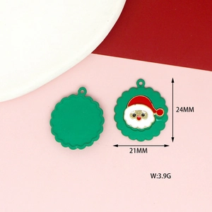 Detail view of a 24x21mm Santa Claus charm with red and green enamel for DIY jewelry