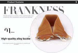 Detail of camel brown elastic waist belt featuring a heart-shaped alloy buckle closure