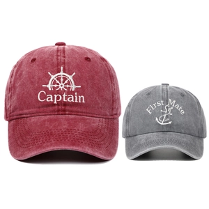 Close-up of embroidered Captain and First Mate logos on washed cotton baseball caps