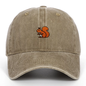 Close-up of orange squirrel embroidery on a vintage washed khaki cotton baseball cap