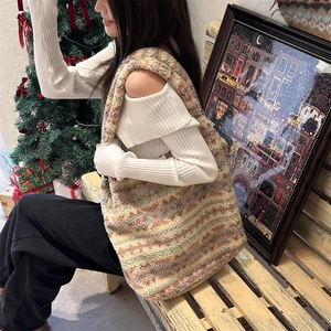 Detail of plush ethnic tote bag featuring colorful mixed woven fuzzy texture and soft wool