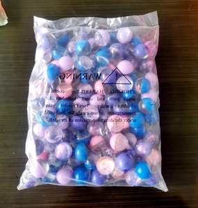 Bulk set of starry translucent bouncy balls with glitter in a large transparent polybag