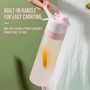 Pink and white gradient sports water bottle with built-in handle and mist spray nozzle