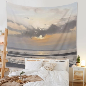 Impressionist sunset ocean tapestry hanging in a cozy bedroom above a minimalist bed