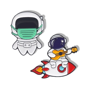 Cartoon astronaut enamel pins set featuring space music theme on a clean white background