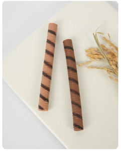 Macro shot of realistic PVC chocolate stick props with brown spiral textured pattern