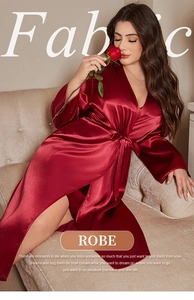 Detailed view of luxury dark red silk robe featuring smooth satin fabric and waist tie