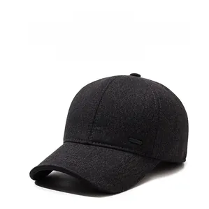 Detail of dark grey wool baseball cap with thick thermal lining and SPORT metal plaque