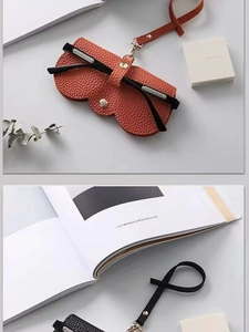 Détails des étuis à lunettes en cuir PU texturé litchi en coloris orange et noir chic