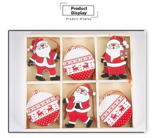 Macro shot of 6-compartment wooden box with cartoon gnome and reindeer ornaments