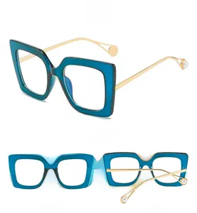 Three-angle view of oversized square glasses with blue frames and pearl-tipped gold temples
