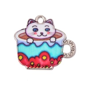 Detailed close-up of a colorful enamel cat in a teacup charm for DIY jewelry making