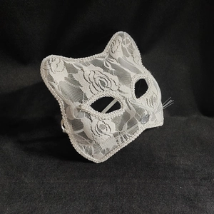 Elegant white lace cat mask for Halloween and parties, featuring intricate hollowed details
