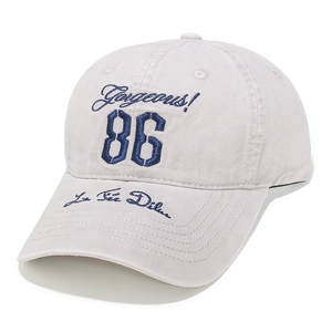 Detail of light gray baseball cap with blue Gorgeous 86 embroidery and twill cotton texture