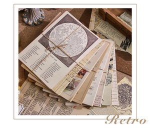 Detail of vintage scrapbooking paper set with moon map tied with natural hemp rope