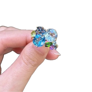Elegant gold open ring featuring geometric colorful zircon stones in a cluster setting