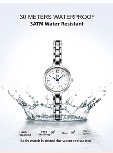 Detail showing 3ATM water resistance of silver quartz watch with splashing water effect