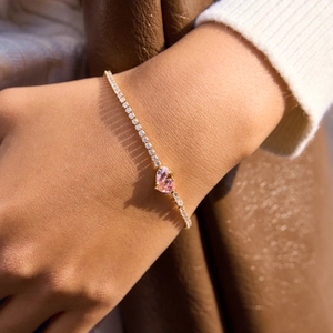18K gold plated tennis bracelet with heart-shaped pink zircons on a delicate chain