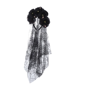Detail of gothic Halloween headband with black roses, mini skulls, and cobweb veil