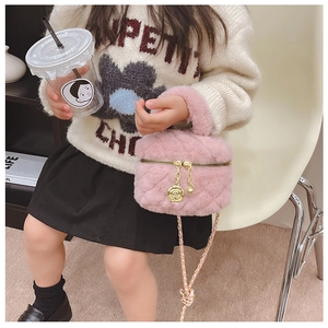 Pink plush kids quilted bag with gold chain and rose pendant shown in child lifestyle setting