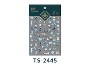 Macro shot of 3D embossed nail stickers featuring blue floral and butterfly motifs