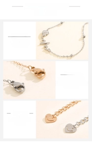 Detailed view of ECG heart charms on medical titanium steel bracelets in silver and rose gold