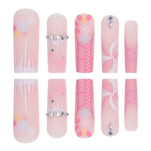 Pink Christmas press-on nails with white snowflakes, glitter and rhinestones decorations