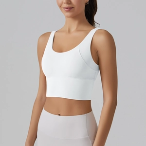 Detail of white V-back sports bra with wide straps and seamless elastic hem for yoga